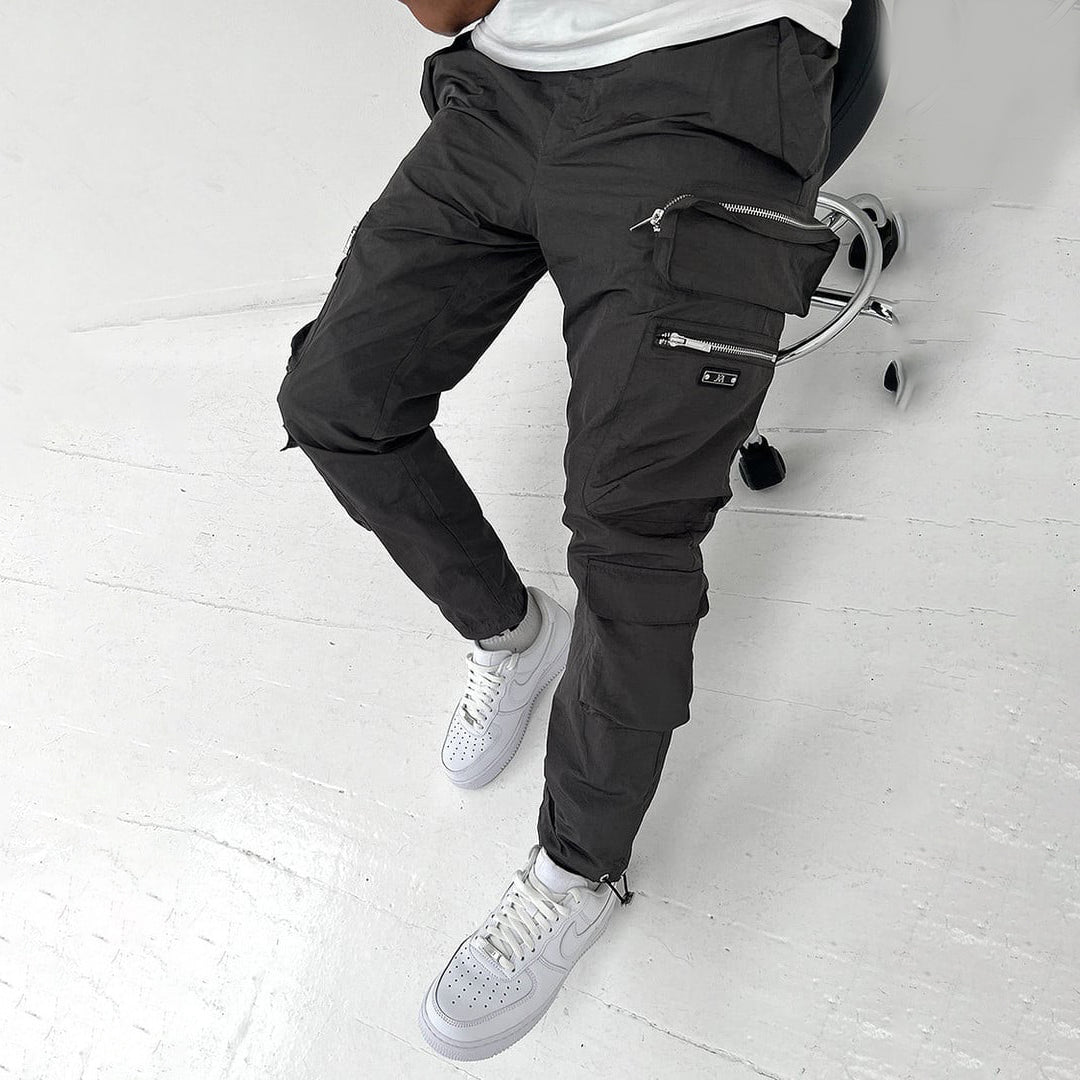  Stylish men's cargo pants with breathable fabric, functional pockets, and a relaxed fit, perfect for summer days.
