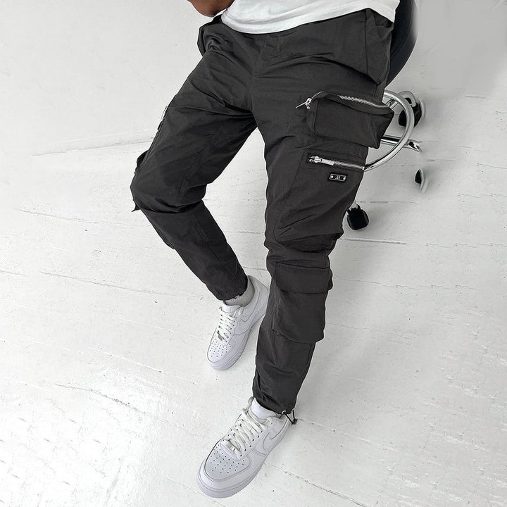  Stylish men's cargo pants with breathable fabric, functional pockets, and a relaxed fit, perfect for summer days.