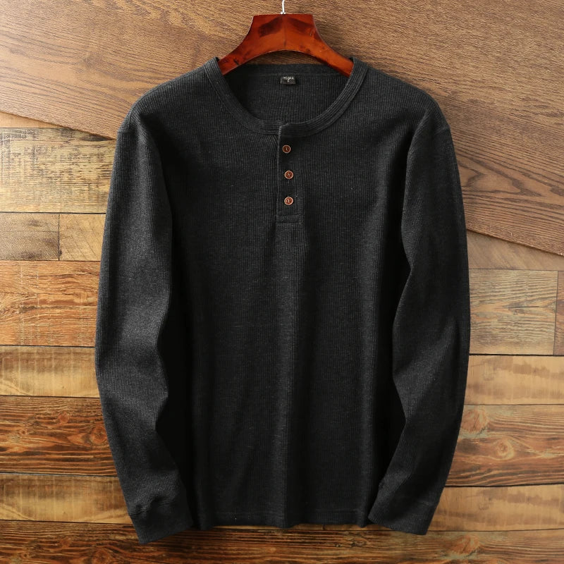 Casual long-sleeve Henley shirt offering a breathable and comfortable design, perfect for summer days.
