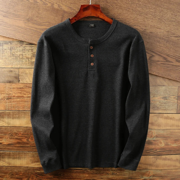 Casual long-sleeve Henley shirt offering a breathable and comfortable design, perfect for summer days.