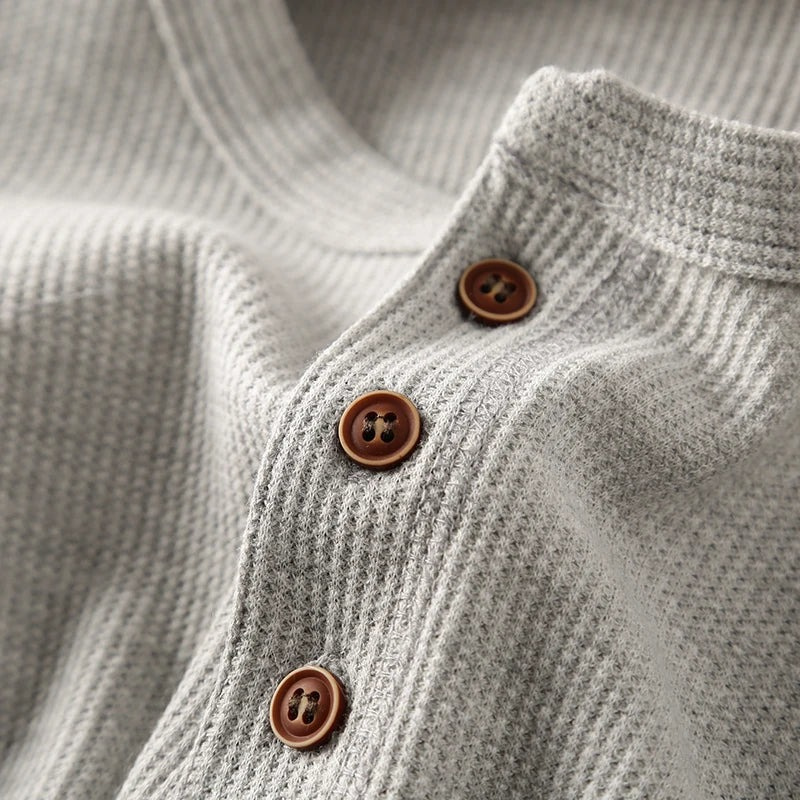 Casual long-sleeve Henley shirt offering a breathable and comfortable design.