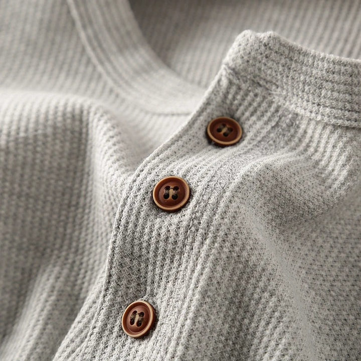 Casual long-sleeve Henley shirt offering a breathable and comfortable design.