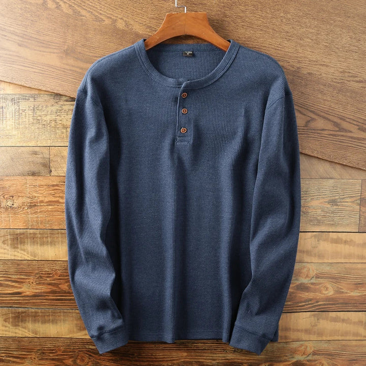 Casual long-sleeve Henley shirt offering a breathable and comfortable design, perfect for summer days.