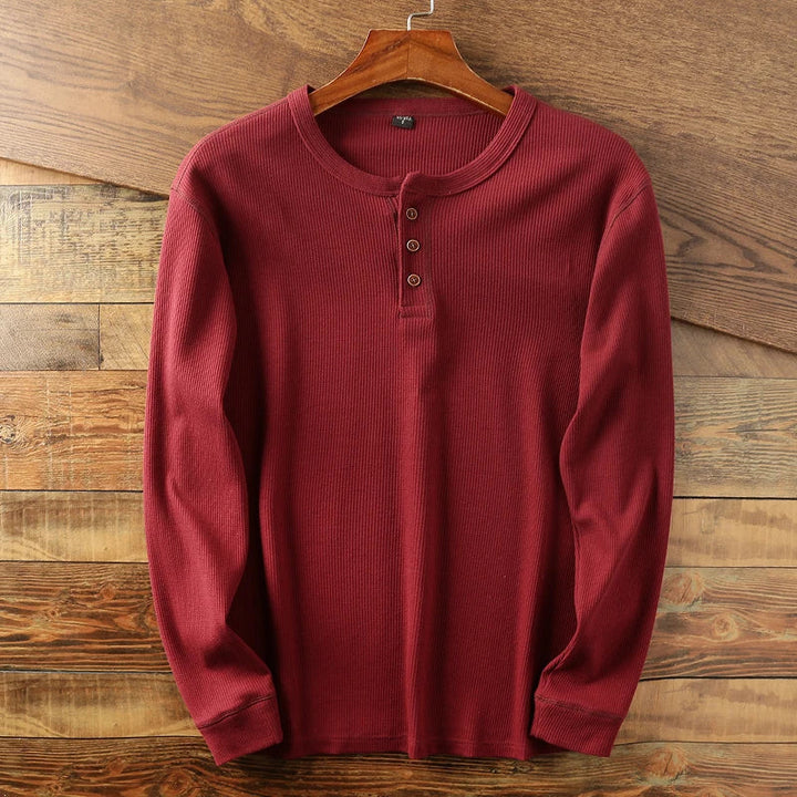 Casual long-sleeve Henley shirt offering a breathable and comfortable design, perfect for summer days.