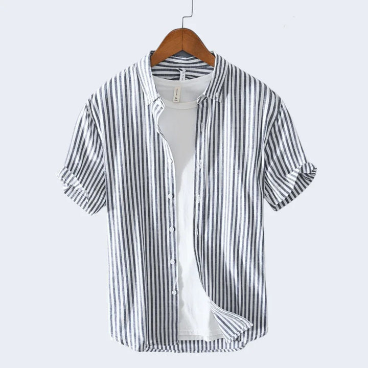  Classic men's beach shirt made from breathable and lightweight fabric, perfect for staying cool and stylish on summer days.