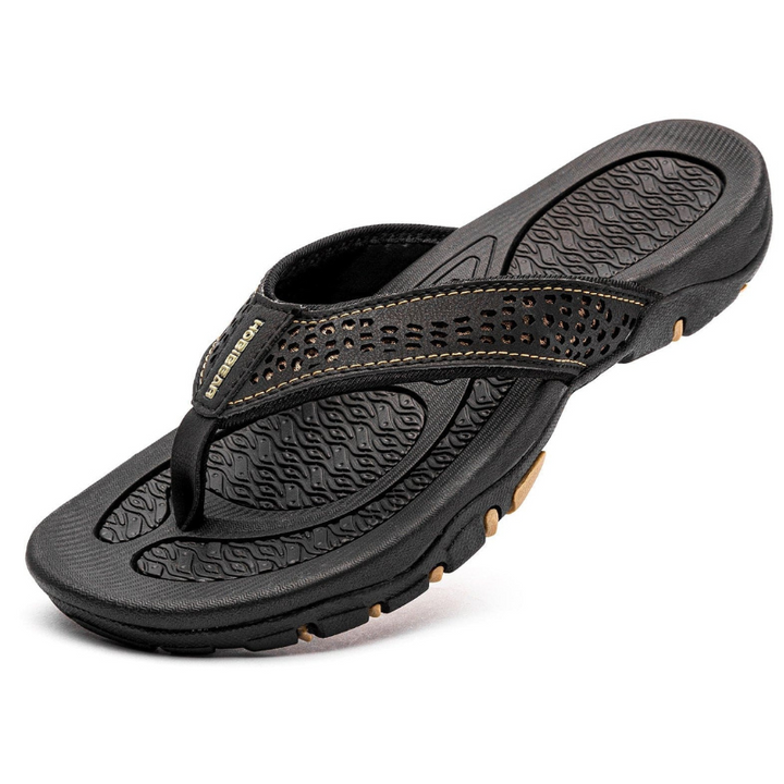 Comfortable men's slippers with cushioned sole and breathable design, ideal for relaxing on summer days.