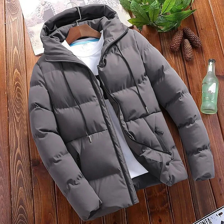 Elegant hooded quilted coat for men with premium insulation, wind protection, and a stylish design for autumn days.