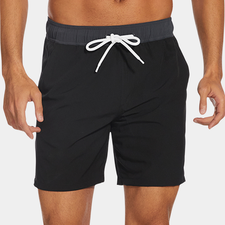 Men's casual swim shorts with quick-dry fabric and adjustable waistband, ideal for beach and pool days.