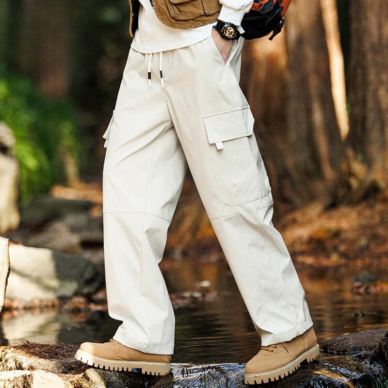 Men’s casual waterproof cargo pants with breathable fabric and multiple pockets, ideal for outdoor adventures and everyday wear.