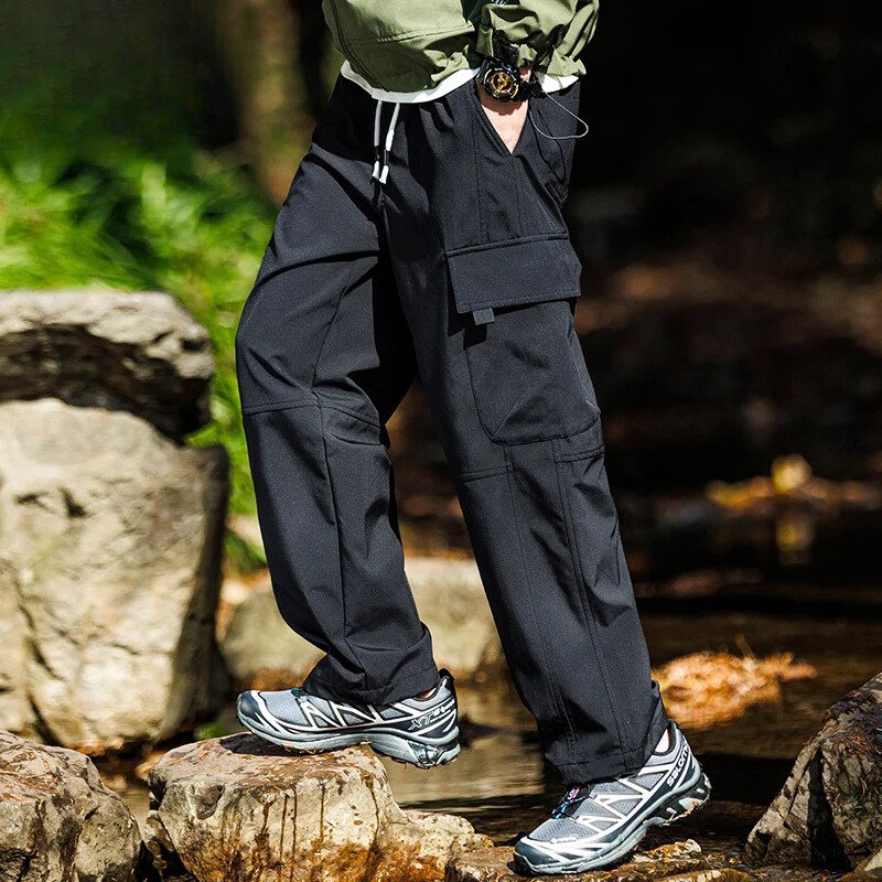 Men’s casual waterproof cargo pants with breathable fabric and multiple pockets, ideal for outdoor adventures and everyday wear.