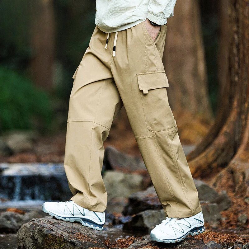 Men’s casual waterproof cargo pants with breathable fabric and multiple pockets, ideal for outdoor adventures and everyday wear.