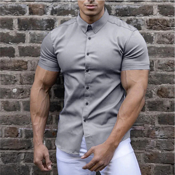 Men's elegant button-down summer shirt, breathable and stylish for warm weather comfort.








