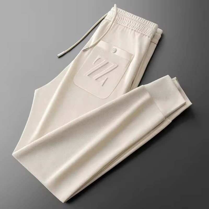 Men's premium jogging pants with a relaxed fit and breathable fabric, perfect for workouts or casual summer days.
