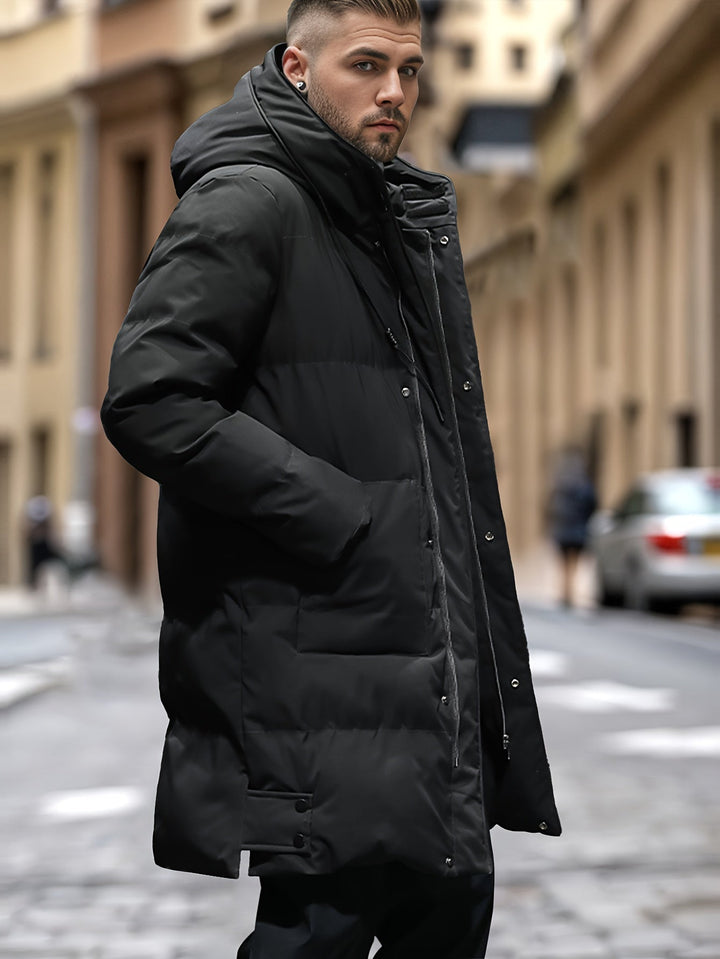 Men's warm and long hooded puffer jacket with insulated padding, windproof and water-resistant fabric, ideal for autumn and winter.







