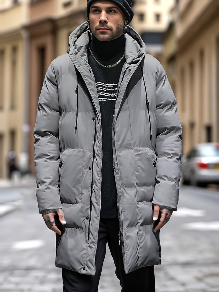 Men's warm and long hooded puffer jacket with insulated padding, windproof and water-resistant fabric, ideal for autumn and winter.







