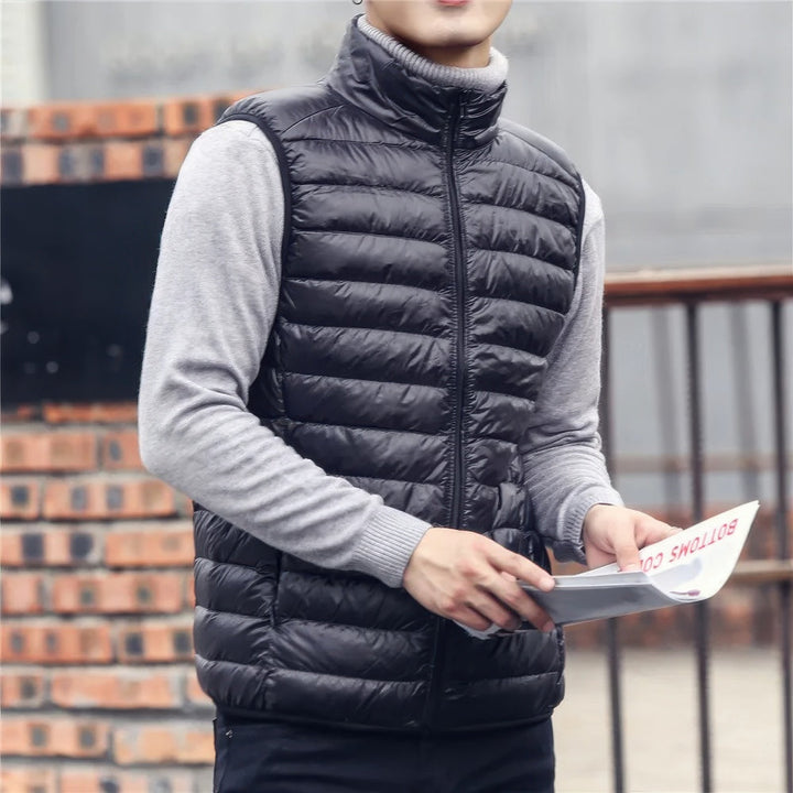 Men's warm sleeveless puffer jacket with lightweight insulation, perfect for layering and staying cozy on chilly days.
