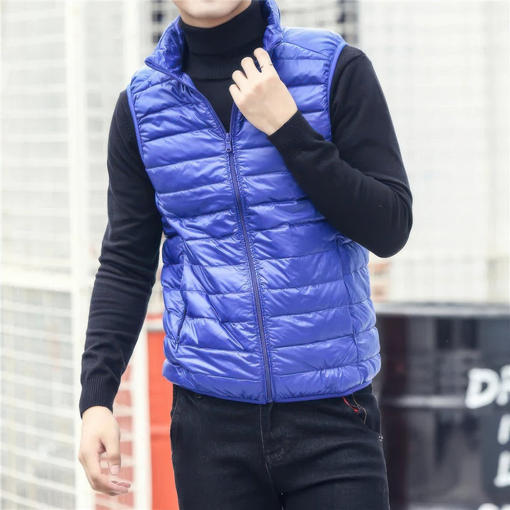 Men's warm sleeveless puffer jacket with lightweight insulation, perfect for layering and staying cozy on chilly days.
