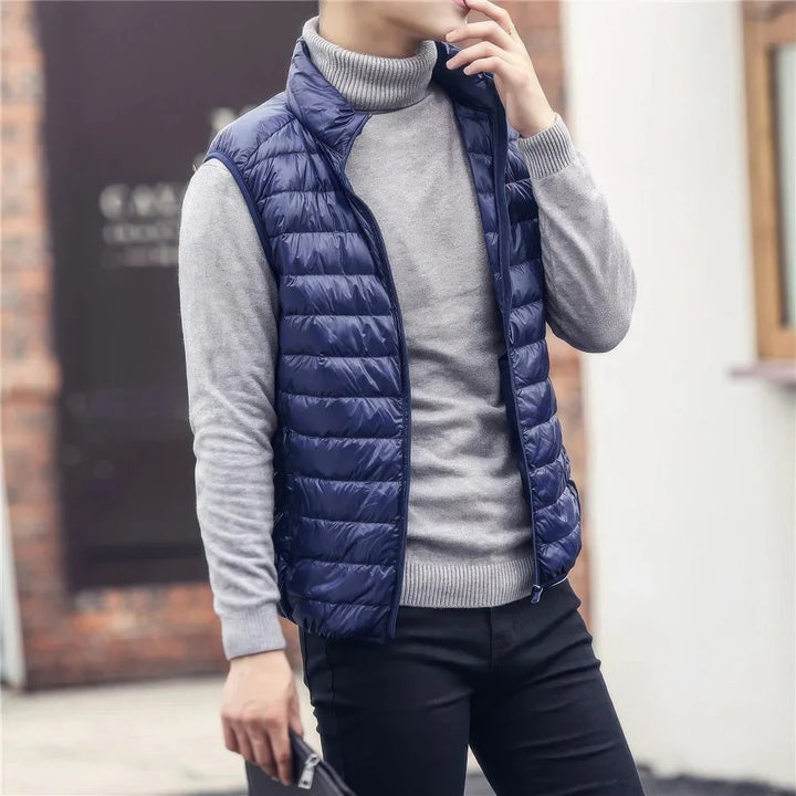 Men's warm sleeveless puffer jacket with lightweight insulation, perfect for layering and staying cozy on chilly days.
