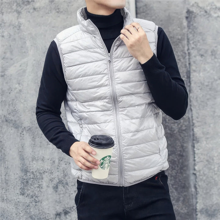 Men's warm sleeveless puffer jacket with lightweight insulation, perfect for layering and staying cozy on chilly days.