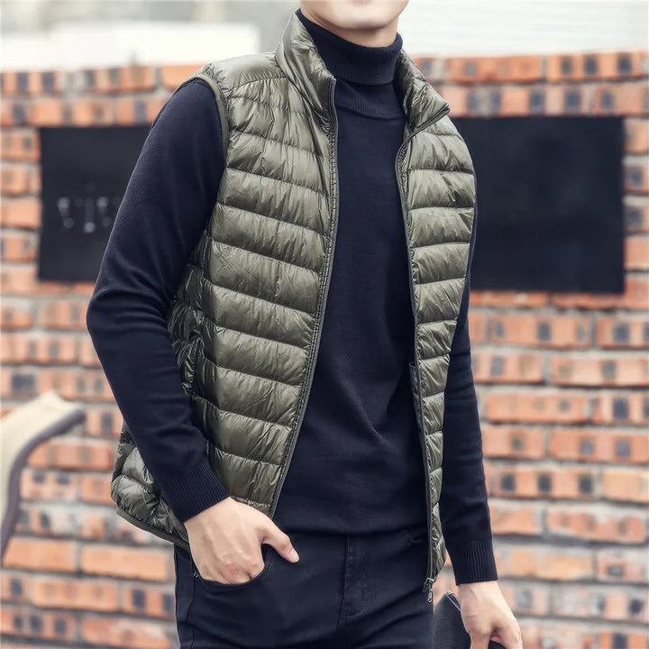 Men's warm sleeveless puffer jacket with lightweight insulation, perfect for layering and staying cozy on chilly days.