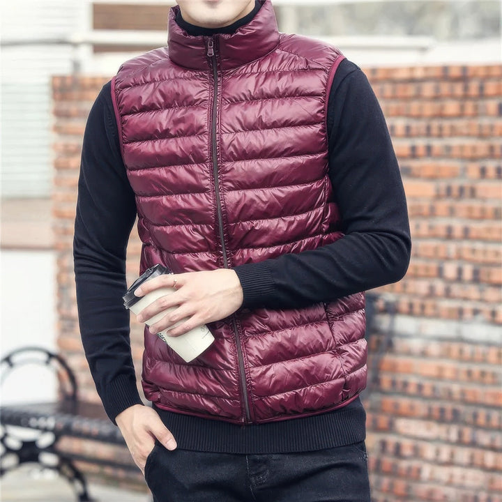 Men's warm sleeveless puffer jacket with lightweight insulation, perfect for layering and staying cozy on chilly days.