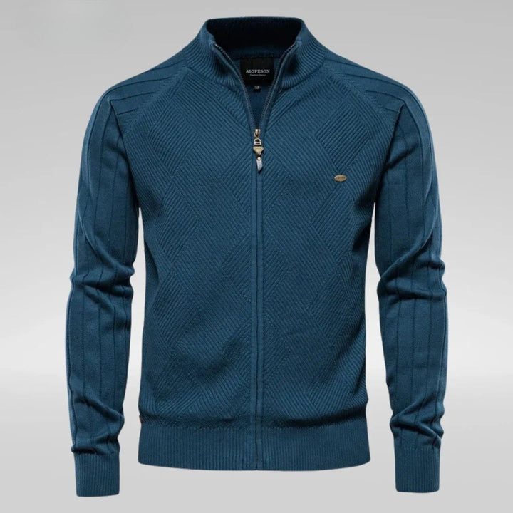 Men's streetwear-style knitted sweater with bold front lettering, featuring a relaxed fit and ribbed cuffs.