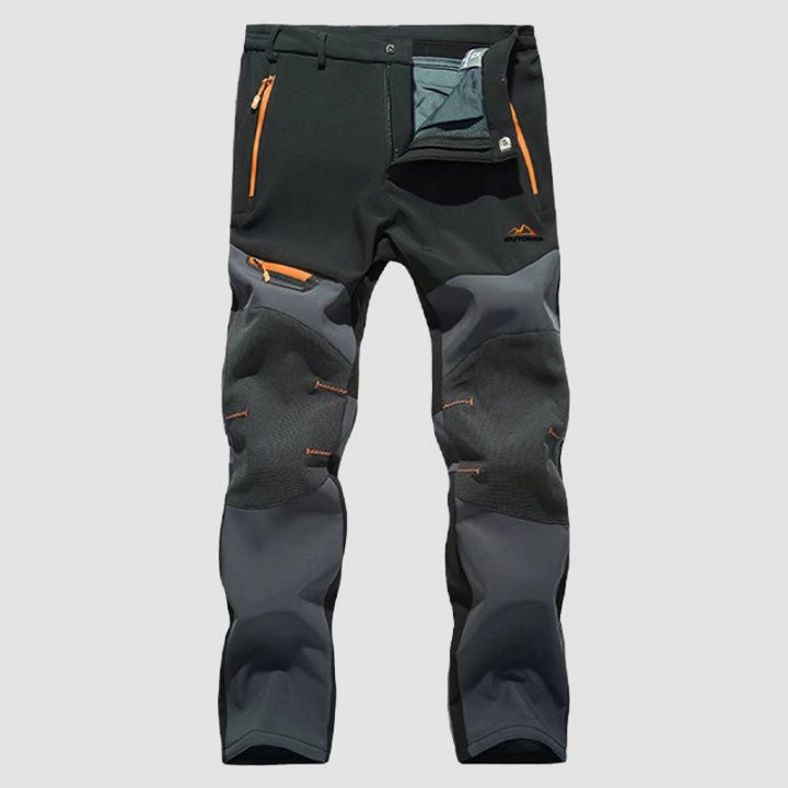 Men's waterproof work pants with reinforced durability, flexible fit, and multiple pockets, ideal for outdoor work and autumn days.







