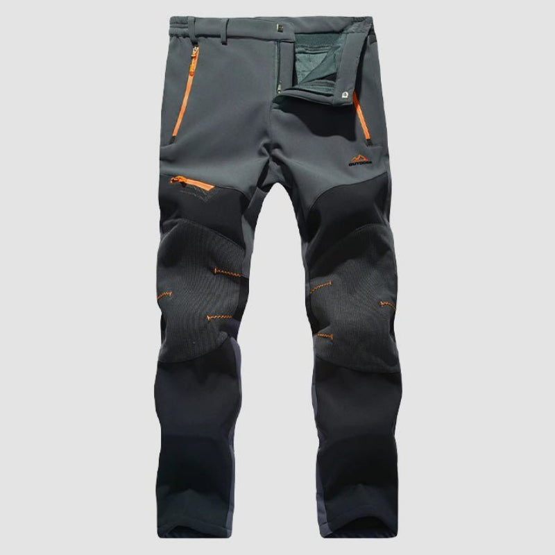 Men's waterproof work pants with reinforced durability, flexible fit, and multiple pockets, ideal for outdoor work and autumn days.







