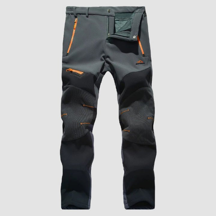 Men's waterproof work pants with reinforced durability, flexible fit, and multiple pockets, ideal for outdoor work and autumn days.







