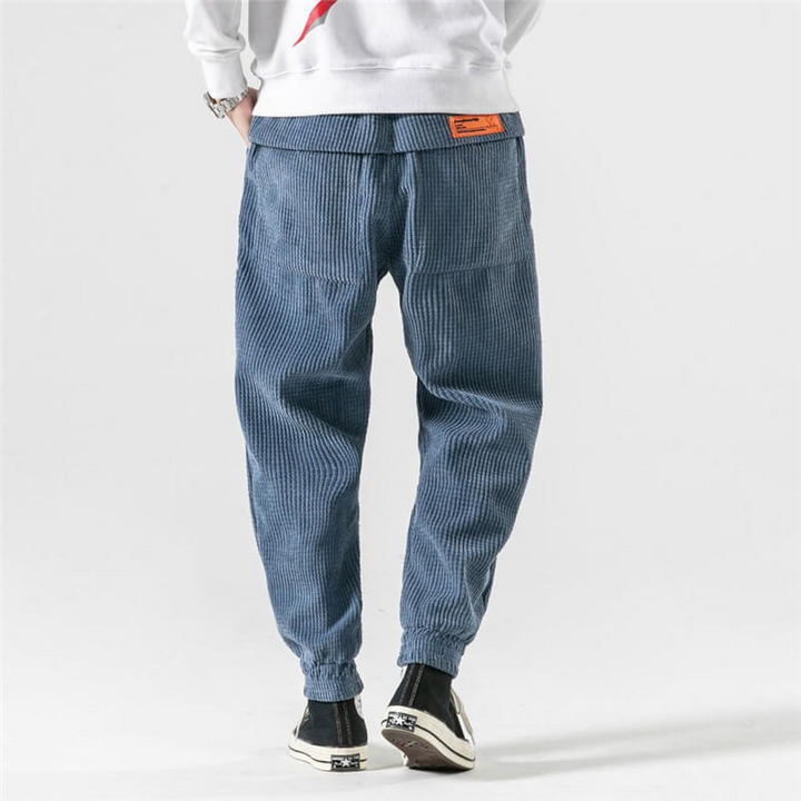 Trendy casual men's corduroy pants with a relaxed fit and breathable design, perfect for summer and versatile styling.