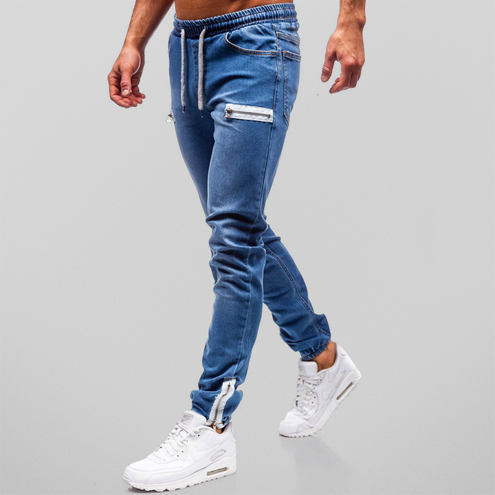 Trendy denim joggers for men perfect for summer, featuring a tapered fit, stretchy denim fabric, and casual streetwear style.