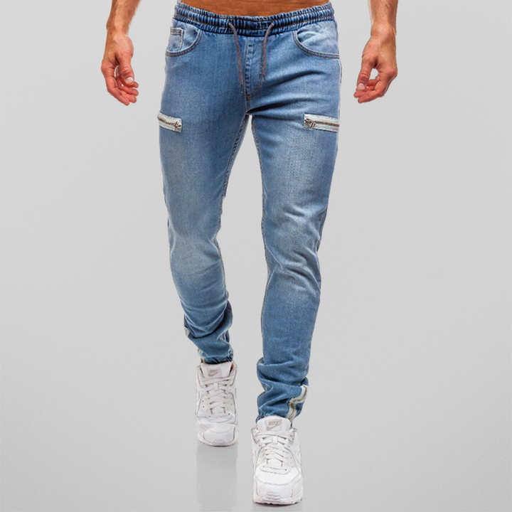 Trendy denim joggers for men perfect for summer, featuring a tapered fit, stretchy denim fabric, and casual streetwear style.